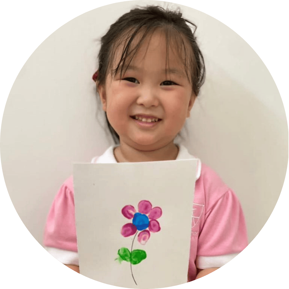Happy Girl Drawing Flower in KinderStars